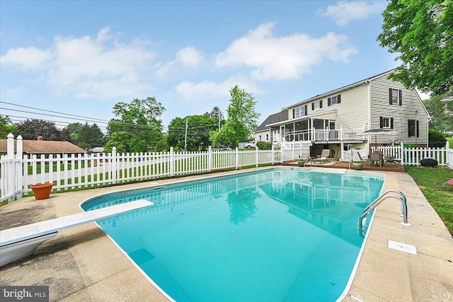 11 Thomas Cir, New Freedom, PA 17349 - view of swimming pool with a diving board, a fenced backyard, a sunroom, and a patio area