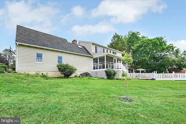 11 Thomas Cir, New Freedom, PA 17349 - rear view of house featuring a sunroom, a chimney, and a shingled roof