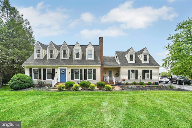 11 Thomas Cir, New Freedom, PA 17349 - cape cod home featuring a front yard, a chimney, and a shingled roof