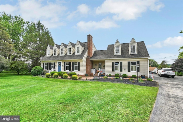 11 Thomas Cir, New Freedom, PA 17349 - cape cod home featuring a chimney, a front lawn, and a shingled roof