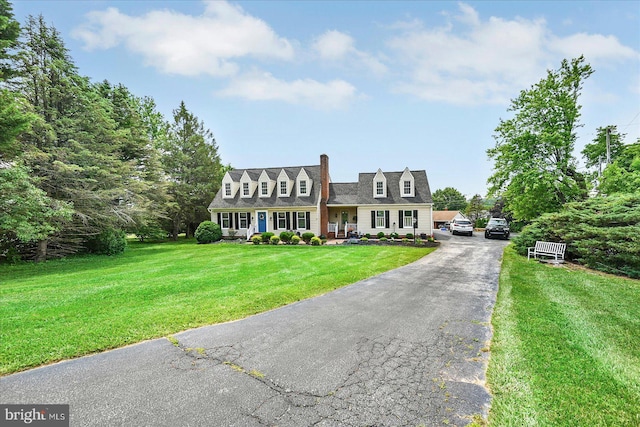 11 Thomas Cir, New Freedom, PA 17349 - cape cod-style house with a front yard and a chimney