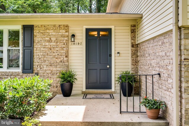 10197 Wavell Rd, Fairfax, VA 22032 - doorway to property featuring brick siding