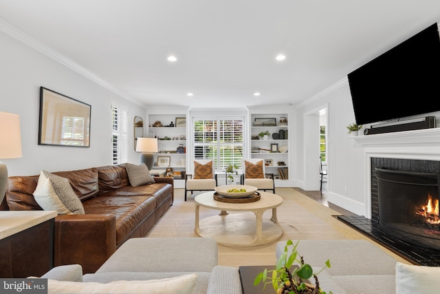661 Timber Ln, Devon, PA 19333 - living area featuring ornamental molding, built in features, a high end fireplace, recessed lighting, and light wood-style floors