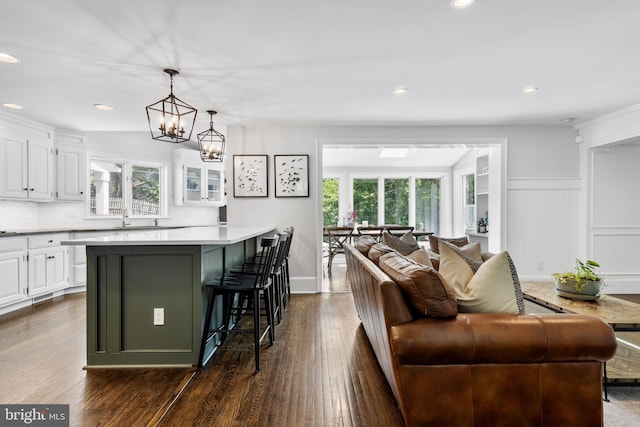 661 Timber Ln, Devon, PA 19333 - kitchen with healthy amount of natural light, white cabinetry, a breakfast bar, and recessed lighting