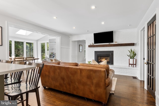 661 Timber Ln, Devon, PA 19333 - living room featuring a fireplace, dark wood-type flooring, a skylight, and recessed lighting