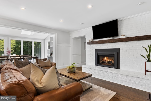 661 Timber Ln, Devon, PA 19333 - living room featuring a brick fireplace, wood finished floors, a decorative wall, recessed lighting, and a wainscoted wall