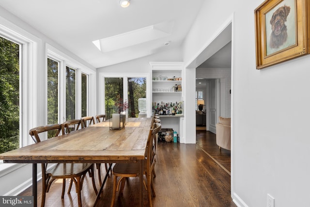 661 Timber Ln, Devon, PA 19333 - dining room with a skylight, lofted ceiling, and dark wood-style flooring