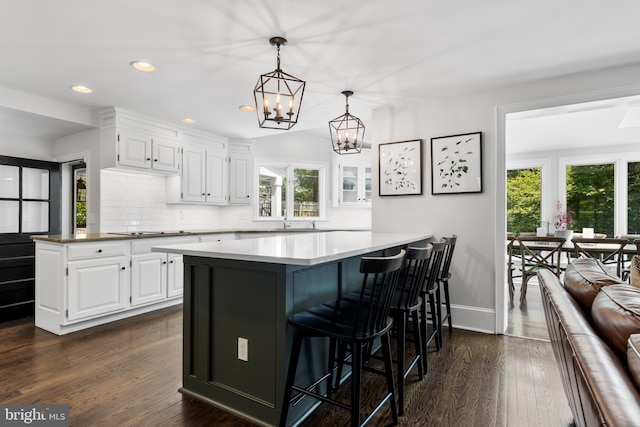 661 Timber Ln, Devon, PA 19333 - kitchen with white cabinets, dark wood-type flooring, a chandelier, a kitchen bar, and recessed lighting