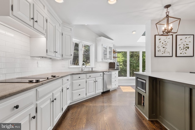 661 Timber Ln, Devon, PA 19333 - kitchen with a sink, stainless steel appliances, white cabinets, dark wood finished floors, and tasteful backsplash