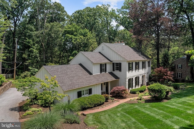 661 Timber Ln, Devon, PA 19333 - view of front facade with roof with shingles and a front yard