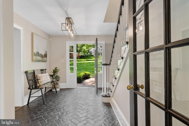 661 Timber Ln, Devon, PA 19333 - foyer featuring brick floors, baseboards, and stairs