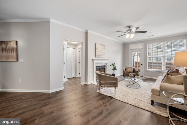 2701 Bellforest Ct Unit 305, Vienna, VA 22180 - living area featuring a fireplace, ceiling fan, dark wood-style floors, crown molding, and baseboards
