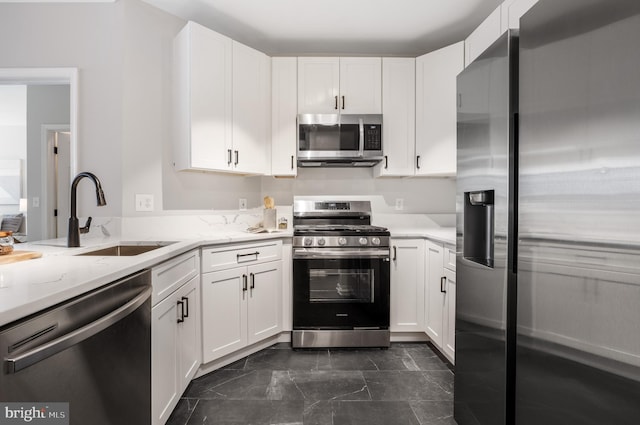 2701 Bellforest Ct Unit 305, Vienna, VA 22180 - kitchen with appliances with stainless steel finishes, a sink, and white cabinets