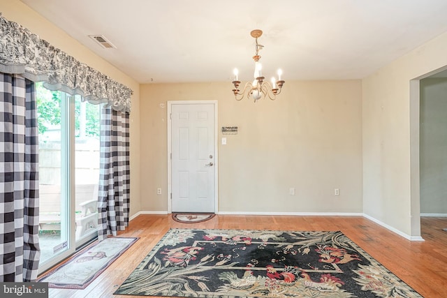 1035 S Beecham Rd, Williamstown, NJ 08094 - foyer with a chandelier, wood-type flooring, and baseboards
