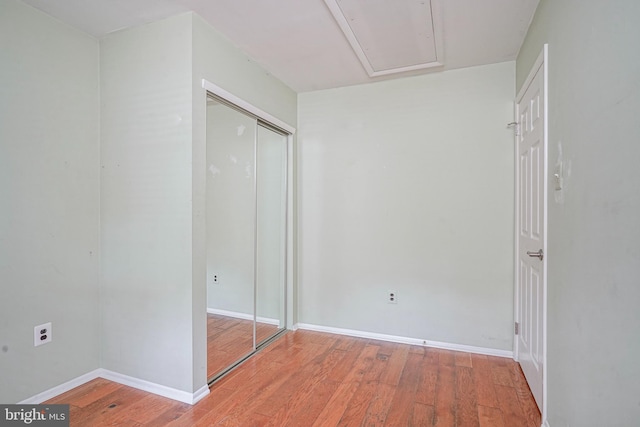 1035 S Beecham Rd, Williamstown, NJ 08094 - unfurnished bedroom featuring wood finished floors, a closet, baseboards, and attic access