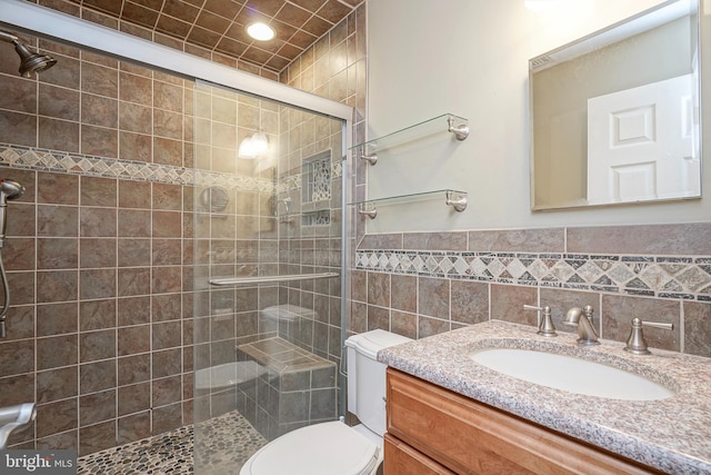 1035 S Beecham Rd, Williamstown, NJ 08094 - full bathroom featuring toilet, vanity, a shower stall, tile walls, and a wainscoted wall