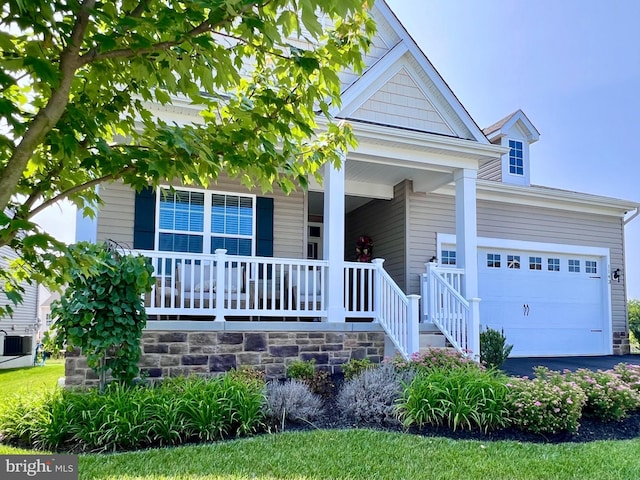 1143 Kayla Ln, Townsend, DE 19734 - view of front facade featuring a porch, a garage, and driveway
