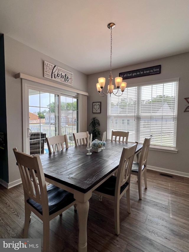 1143 Kayla Ln, Townsend, DE 19734 - dining area with a chandelier, baseboards, and wood finished floors