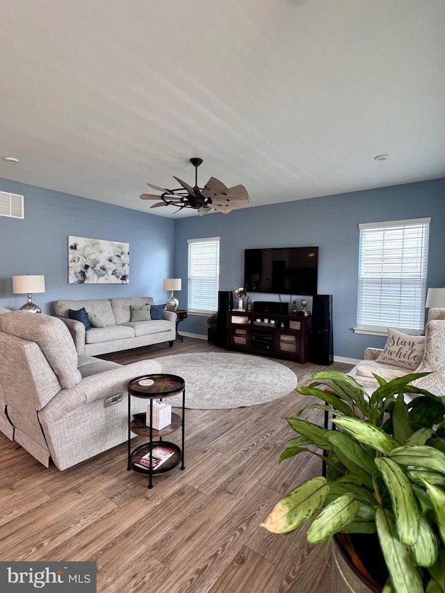 1143 Kayla Ln, Townsend, DE 19734 - living area featuring wood finished floors, baseboards, and a ceiling fan