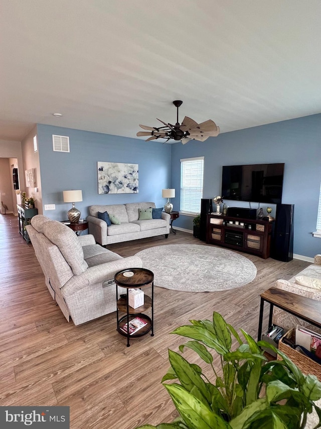 1143 Kayla Ln, Townsend, DE 19734 - living area featuring wood finished floors, ceiling fan, and baseboards