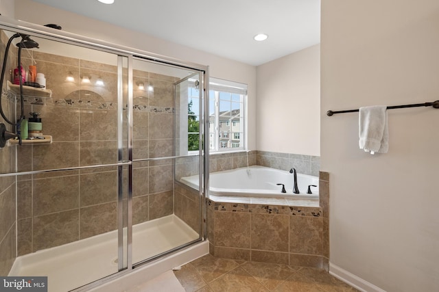 45711 Winding Branch Ter, Sterling, VA 20166 - bathroom with tile patterned flooring, a shower stall, a bath, and recessed lighting