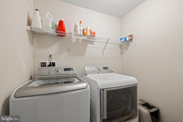 45711 Winding Branch Ter, Sterling, VA 20166 - laundry room featuring separate washer and dryer