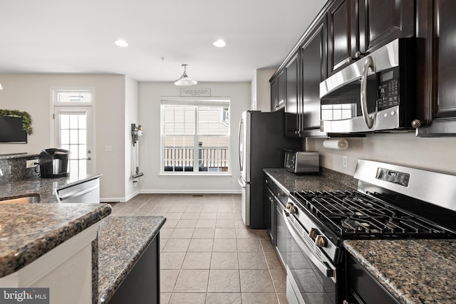 45711 Winding Branch Ter, Sterling, VA 20166 - kitchen featuring appliances with stainless steel finishes, baseboards, light tile patterned floors, a sink, and recessed lighting
