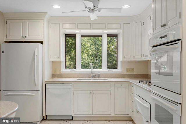 516 Merrimans Ln, Winchester, VA 22601 - kitchen featuring white appliances, a warming drawer, light countertops, ceiling fan, and backsplash