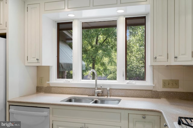 516 Merrimans Ln, Winchester, VA 22601 - kitchen with dishwasher, white cabinets, and light countertops