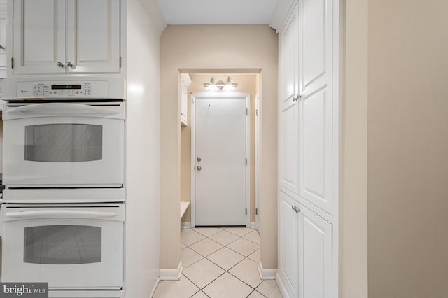 516 Merrimans Ln, Winchester, VA 22601 - kitchen with double oven, light tile patterned floors, and white cabinets