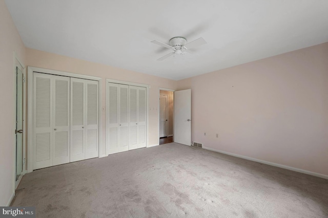 516 Merrimans Ln, Winchester, VA 22601 - unfurnished bedroom with carpet flooring, multiple closets, and a ceiling fan