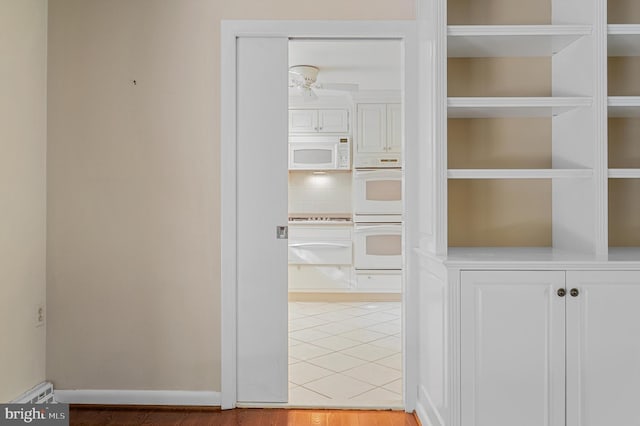 516 Merrimans Ln, Winchester, VA 22601 - corridor featuring light tile patterned flooring and baseboards