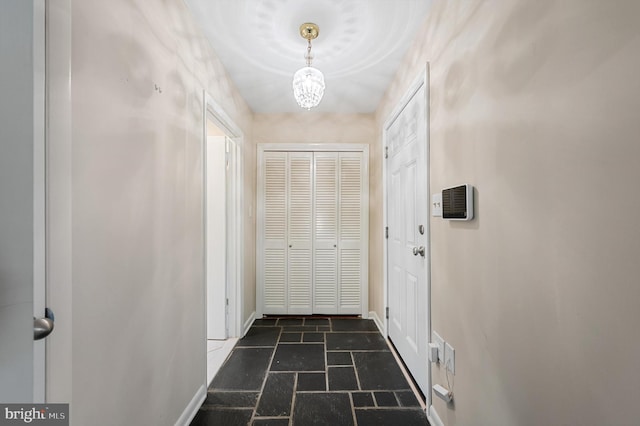 516 Merrimans Ln, Winchester, VA 22601 - entryway featuring stone tile flooring and a chandelier