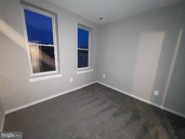 1742 U St NW Unit 203, Washington, DC 20009 - spare room featuring dark colored carpet and baseboards
