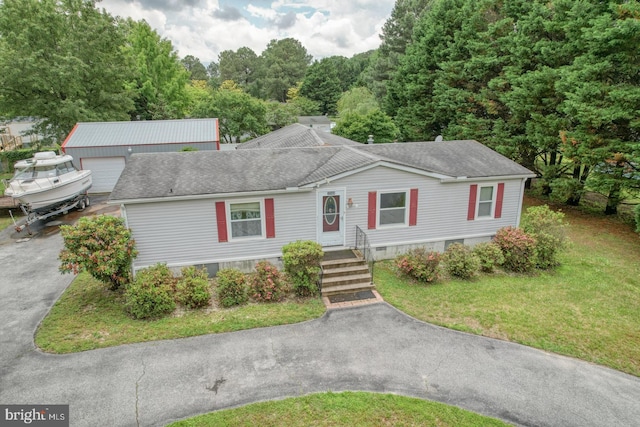 32588 Captains Way, Millsboro, DE 19966 - view of front of home featuring driveway, a front yard, a shingled roof, and a garage