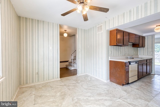 8798 Victory Ct, Walkersville, MD 21793 - kitchen with stainless steel dishwasher, wallpapered walls, light countertops, ceiling fan, and baseboards