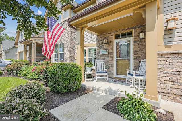 36769 E Pebble Beach Dr, Frankford, DE 19945 - view of exterior entry with covered porch and stone siding