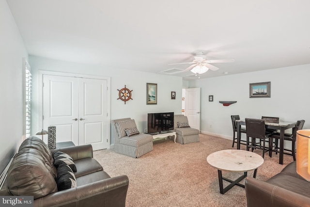 36769 E Pebble Beach Dr, Frankford, DE 19945 - carpeted living room featuring ceiling fan and baseboards