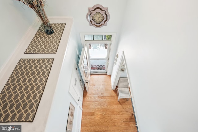 36769 E Pebble Beach Dr, Frankford, DE 19945 - stairway with a towering ceiling and wood finished floors