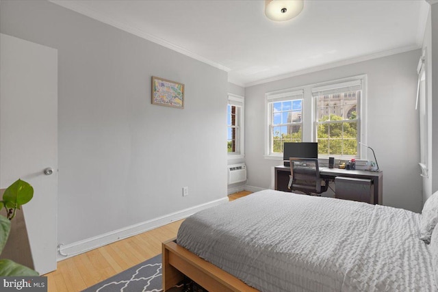 3028 Wisconsin Ave NW Unit 402, Washington, DC 20016 - bedroom featuring crown molding, wood finished floors, and a wall unit AC