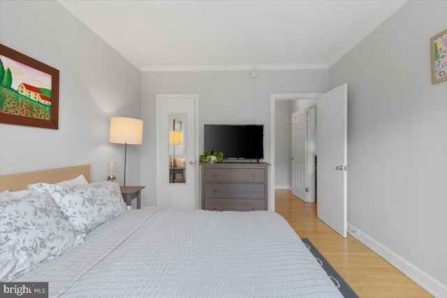 3028 Wisconsin Ave NW Unit 402, Washington, DC 20016 - bedroom featuring wood finished floors and crown molding