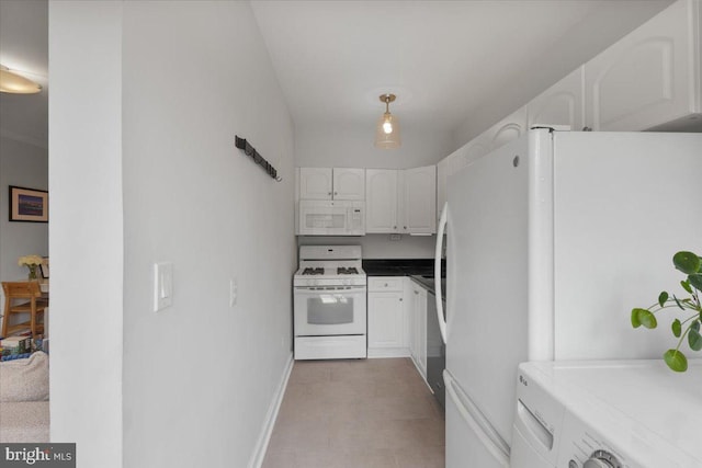 3028 Wisconsin Ave NW Unit 402, Washington, DC 20016 - kitchen with white appliances, white cabinetry, and washer / clothes dryer