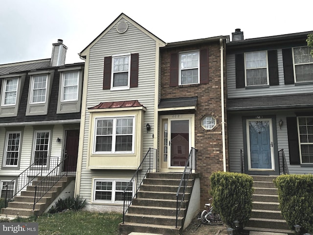 4682 Joanna Ct, Woodbridge, VA 22193 - view of property with entry steps and a chimney
