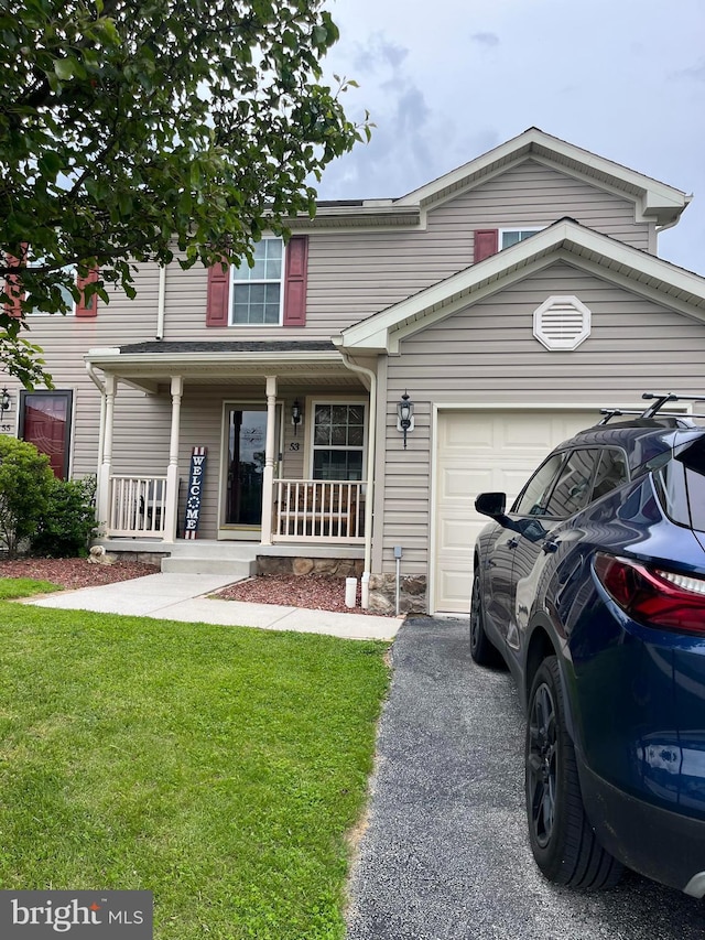 53 Skyview Cir, Hanover, PA 17331 - view of front of home with a porch, a garage, a front lawn, and asphalt driveway