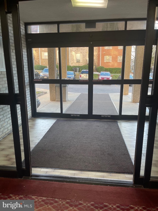 12001 Old Columbia Pike Unit 207, Silver Spring, MD 20904 - entryway featuring a wall of windows