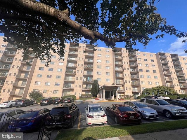 12001 Old Columbia Pike Unit 207, Silver Spring, MD 20904 - view of apartment building / complex with uncovered parking