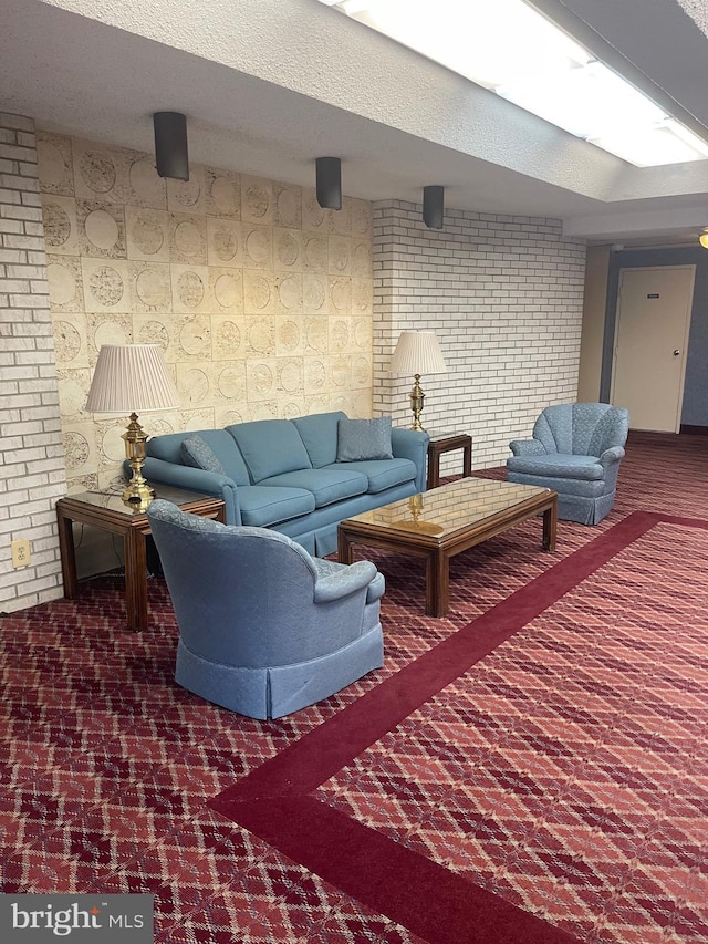 12001 Old Columbia Pike Unit 207, Silver Spring, MD 20904 - carpeted living room with brick wall