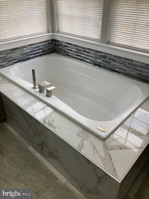 9831 Endora Ct, Owings Mills, MD 21117 - full bathroom with a bath and marble finish flooring