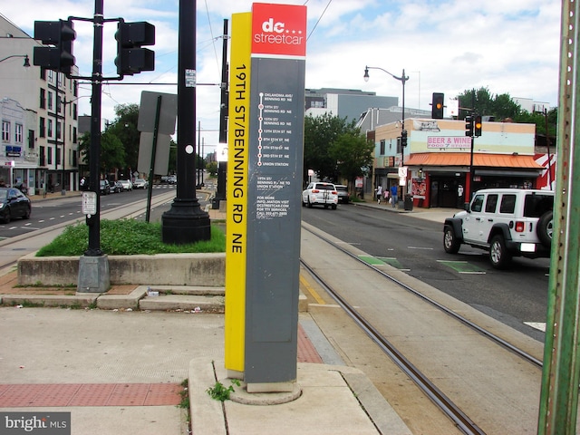 610 NE 21st St NE, Washington, DC 20002 - view of asphalt street featuring sidewalks, curbs, traffic lights, and street lighting