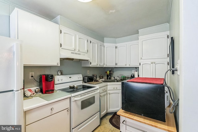 941 Fairfax Rd, Drexel Hill, PA 19026 - kitchen featuring white appliances, under cabinet range hood, white cabinetry, and light countertops